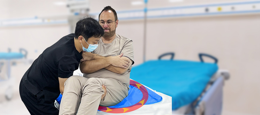 Elderly person using mobility aid with caregiver assistance